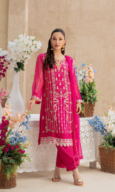 Shamooz- Mushq Volume 3. Wrap yourself in beautiful design with elegant embroidered along with adornment handwork. Paired with raw silk pants and a chiffon dupatta adorned with embroidered work, this outfit is a masterpiece of timeless beauty .