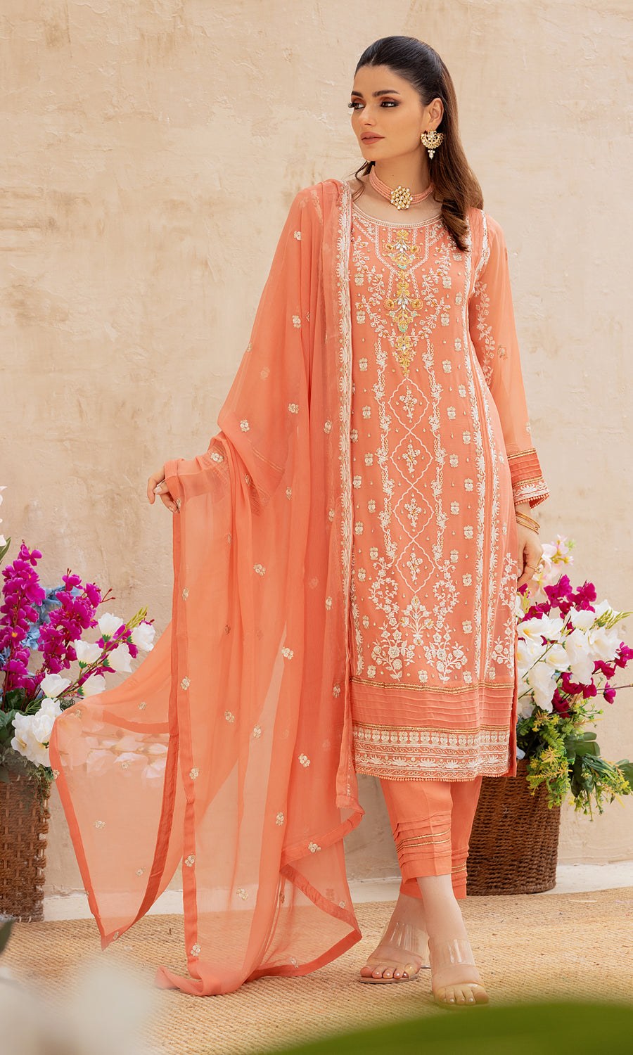 Shamooz- Mushq Volume 3. Step into elegance with style masterpiece with vibrant color and embrodiery work on the front and side panel that enhances a pop of color.The delicately hand-embellished add-on sparkle of glamour.This ensemble is a perfect balance of every occassion.