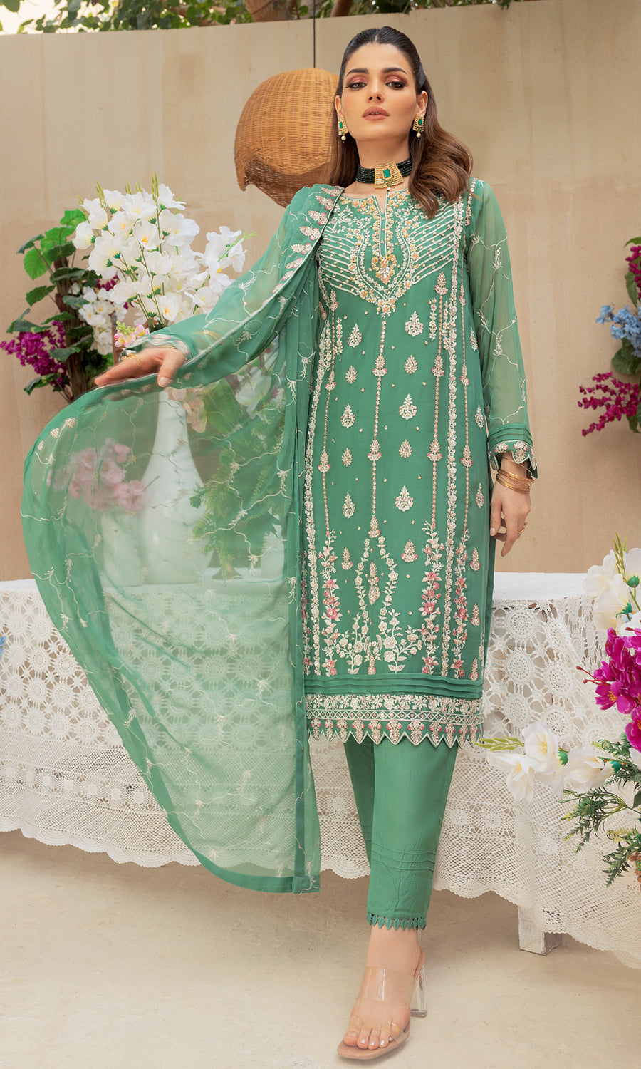 Shamooz-Mushq Volume 3. Step into elegance with this masterpiece with vibrant color and embrodiery work on the front and side panel that enhances a pop of color and elevate the design.The delicately hand-embellished adds a touch of glamour.This ensemble is a perfect balance of elegance.